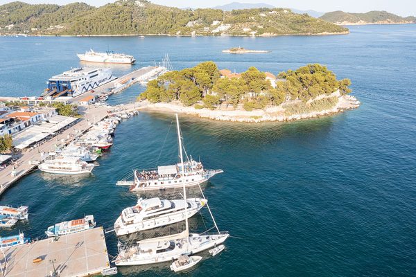 The pine-covered Bourtzi headland dividing the Skiathos Town waterfront